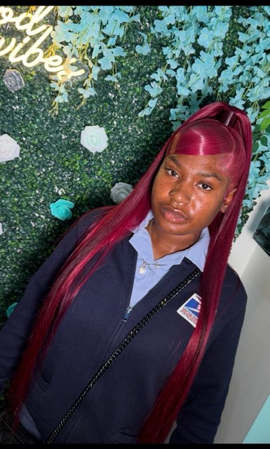 Burgundy high ponytail with a swooped bang