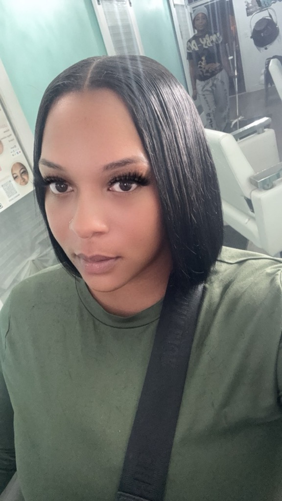 Sleek middle part, long lashes