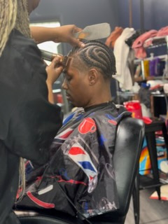 Braiding a client in the salon
